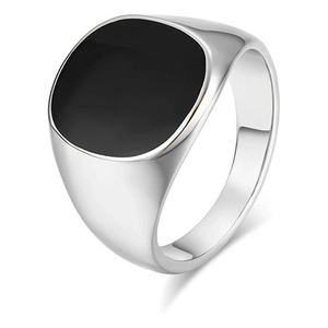 Close-up of a silver titanium steel ring with a polished black resin inlay centerpiece