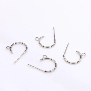 Detailed view of silver C-shaped earring posts with loop and S925 hallmark for DIY jewelry