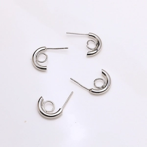 Macro shot of silver S925 C-shaped earring posts with small loop for DIY jewelry making