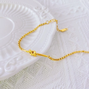 Minimalist 18k gold-plated knot chain bracelet with adjustable extender for women