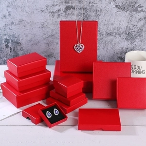 Detailed view of red textured jewelry gift box set in various sizes and shapes
