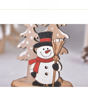 Close-up of hand-painted wooden snowman and Christmas tree tabletop ornament decoration