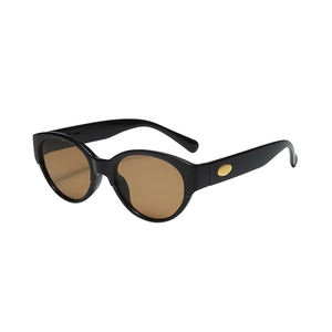 Lunettes de soleil œil de chat ovales vintage à monture noire et verres ambrés