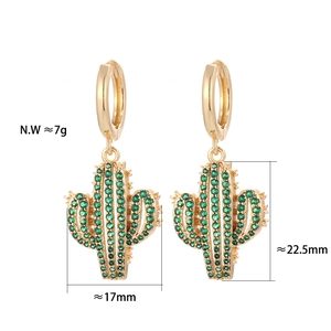 Detail view of gold hoop earrings with green zircon cactus charms and size dimensions