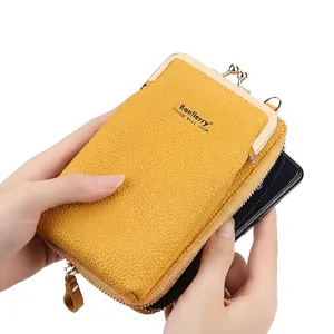 Vertical yellow litchi pattern leather phone bag with metallic clasp and zipper strap