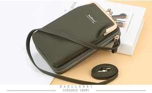 Detail of army green lychee pattern phone bag with golden metal hardware and long strap