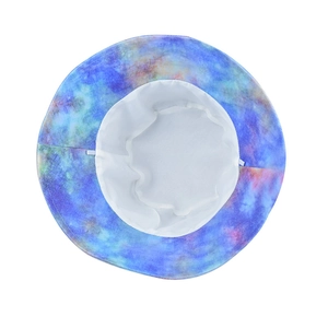 Vibrant tie-dye bucket hat in blue and purple colors with wide brim for sun protection