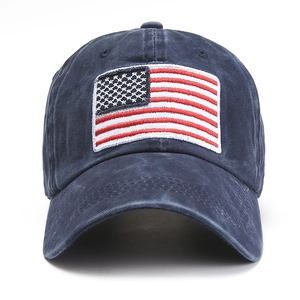 Detail of USA flag embroidery on navy washed cotton baseball cap with vintage finish