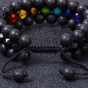 Detail of adjustable braided cord and porous texture of natural lava rock chakra beads