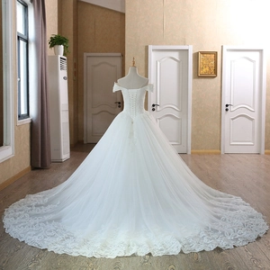 Elegant off-shoulder lace wedding dress with ball gown silhouette and long chapel train