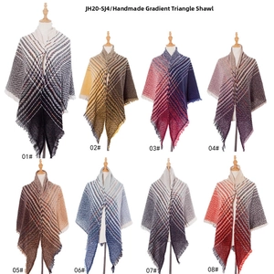 Detail showing eight color options of plaid triangle scarves with fringe on mannequins