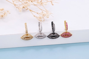 Detail of red lip earrings in four metal finishes with sparkling zircon micro-pave