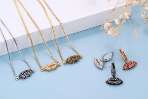 Detailed view of red lip pendants with micro-pave cubic zirconia on layered display