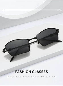 Macro detail of black geometric fan-shaped sunglasses with metal temples on a display