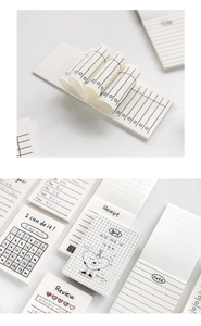 Detailed view of minimalist white notepad pages with grid, lines, and review templates