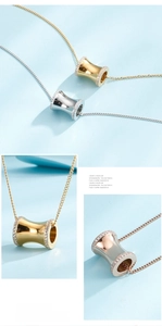 Close-up of cylinder pendant necklace with pave-set crystals in gold, silver, and rose gold