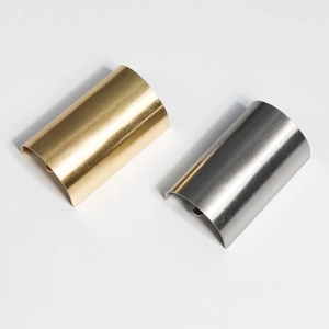 Japanese style brushed metal hair hooks in gold and silver finish on white background