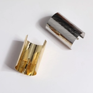 Minimalist gold and silver ponytail hair hooks with brushed metal texture for women