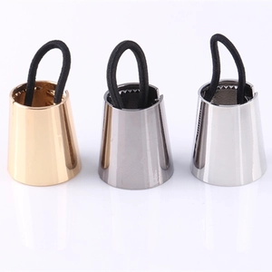Three-piece metallic ponytail cuff set in gold, gunmetal, and silver with black elastic