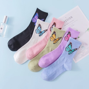 Six pairs of colorful cotton blend crew socks with butterfly patterns in vibrant colors