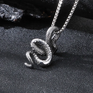 Punk style stainless steel snake pendant with oxidized texture on a box chain