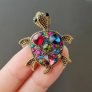 Exquisite turtle brooch with colorful rhinestones on a vintage gold-tone metal base