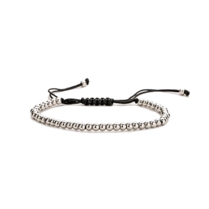 Adjustable black woven bracelet featuring metallic silver beads on a clean white background