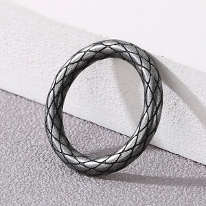 Close-up of vintage silver punk ring with detailed snake skin texture and scale patterns
