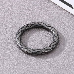 Macro shot of punk style stainless steel ring with vintage snake scale texture detail
