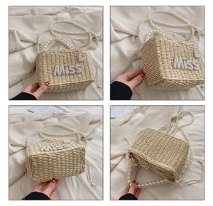Detail view of woven beach bag with pearl Miss lettering and drawstring closure