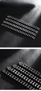 Macro detail of 316L stainless steel motorcycle chain bracelet with punk mechanical links