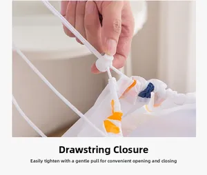 Detail showing the drawstring toggle closure of the waterproof PEVA quilt storage bag