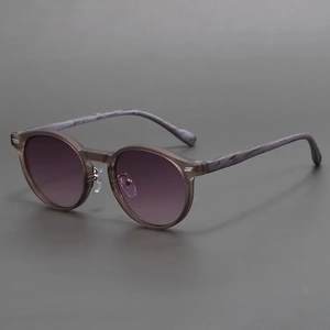 Retro round frosted sunglasses with grey frames and marble pattern temples
