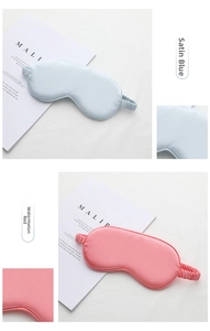 Close-up of dual-sided satin sleep masks in silk blue and watermelon red colors