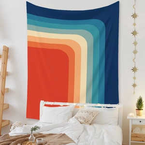 Bedroom scene with colorful retro rainbow wave wall tapestry hung as a bed headboard