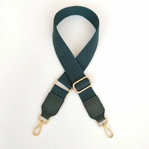 Adjustable dark green canvas bag strap with golden metal buckles and leather connector