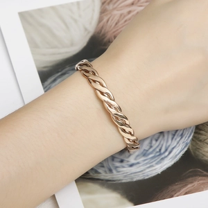 Rose gold twisted woven bangle in stainless steel, elegant spiral metal bracelet for women