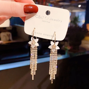 Detailed shot of long flower tassel earrings with S925 silver pins and sparkling crystals