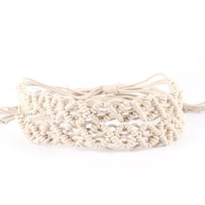 Macro view of handmade woven hemp rope accessories with vintage bull head decoration