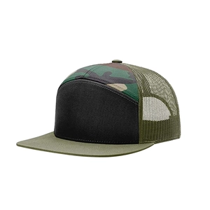 Detail view of 7-panel flat brim trucker hat with green camo pattern and mesh back
