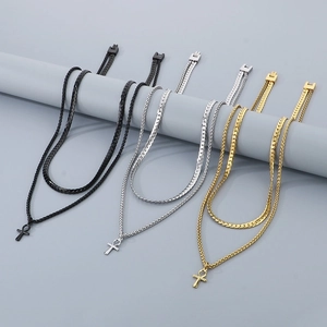Detailed view of double-layer stainless steel Ankh cross necklaces in black, gold, and silver