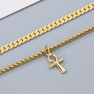 Double layered gold stainless steel necklace featuring Cuban chain and Ankh cross pendant