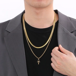 Men's double-layered gold Ankh cross pendant necklace in stainless steel on a model