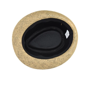 Detail of the straw fedora hat interior showing the 58cm size tag and sweatband