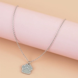 Luminous paw print pendant necklace with stainless steel O-chain on pink display