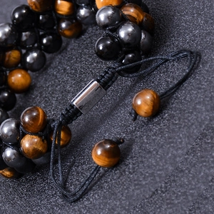Triple-layer braided tiger eye and hematite stone bracelet with adjustable metal slider