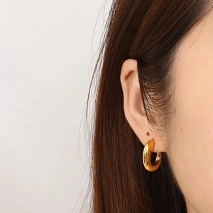 Polished gold-plated C-shaped chunky hoop earrings for women in stainless steel
