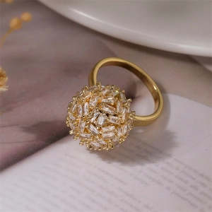 Detailed close-up of a golden copper ring featuring micro-pave rectangular cubic zirconia
