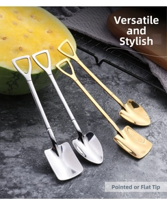 Close-up of creative pointed and flat head stainless steel shovel spoons in gold and silver