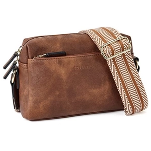 Detail view of brown leather crossbody bag with striped strap and gold metal hardware